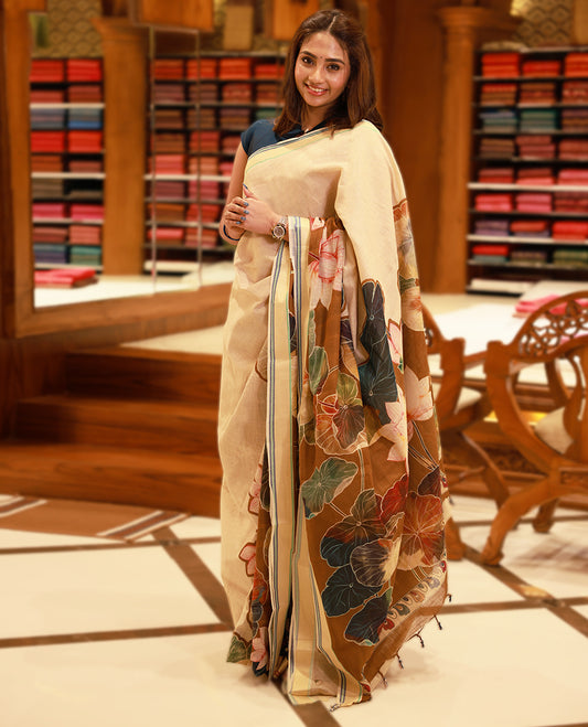 Beige and Brown Colour lightweight khadi cotton saree with earthy-coloured digital floral prints on the Body and pallu, paired with a matching blouse.