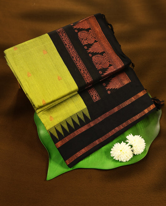 Lemon Green colour mixed Kalyani cotton saree featuring Copper zari motifs throughout the body, paired with Pure Black colour traditional border and pallu, with matching blouse