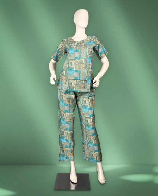 Teal and beige colour geometric print women's nightwear set featuring a round neck with piping detail, short sleeves, and comfortable straight-fit pants.