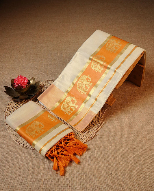Golden colour Tissue silk set mundu features a plain body accented by a Elephant print on gold & orange zari border.