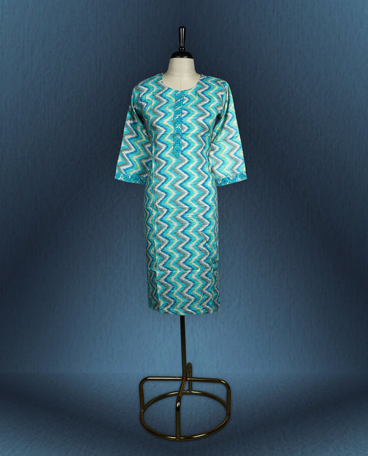 Aqua blue colour kurti with an all over zigzag pattern in shades of white and teal, styled with a round neckline featuring a short button placket, and complemented by three quarter sleeves