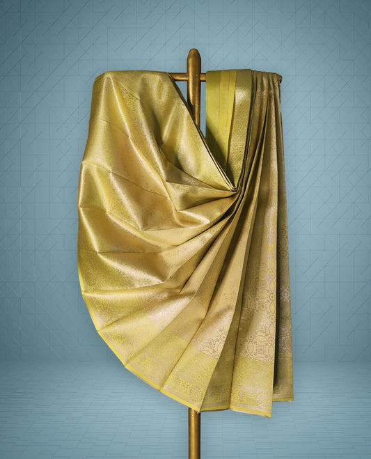 Pastel Mustard colour semi tissue saree featuring a brocade body, Contrast border, and a matching Contrast blouse.