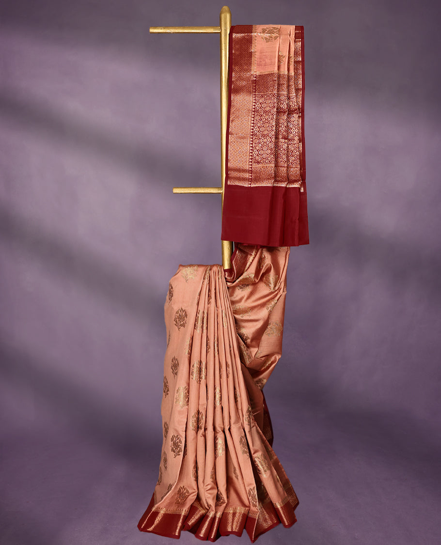 Peach Colour Pure Banaras Soft Silk Saree adorned with traditional antique zari motifs, paired with a hand dyed Maroon antique style border and a matching blouse.