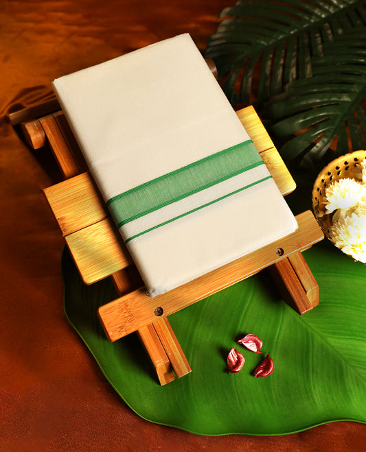Off white colour cotton single dhoti featuring a light green kara with fine double line edging, crafted for traditional elegance and daily comfort, perfect for rituals, temple visits, and cultural occasions.