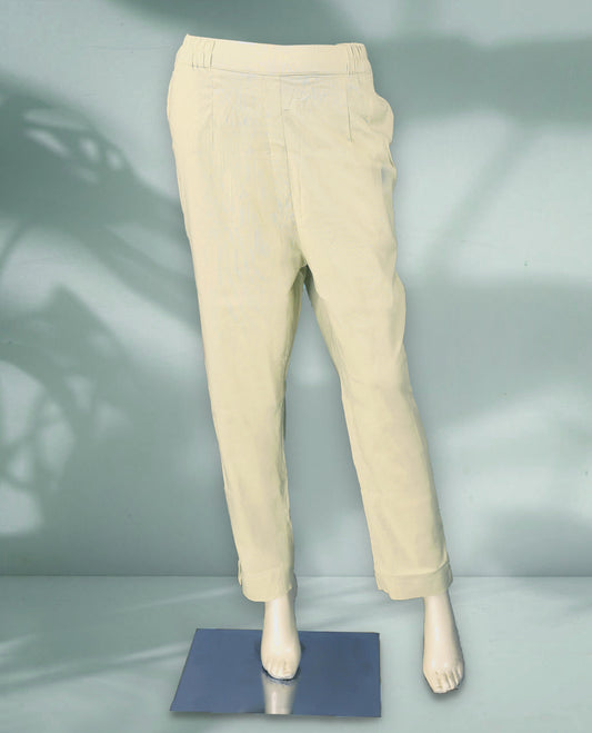 Light beige colour women's pants feature a clean, tapered silhouette with an elastic waistband and turn up hems