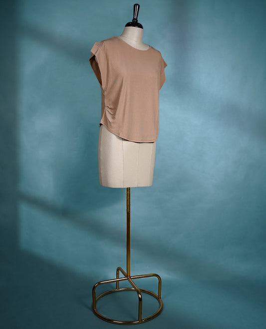 Beige cap sleeve top featuring a round neck and relaxed fit, made from lightweight textured fabric for a chic, effortless style.