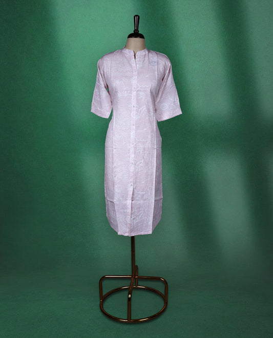 Baby pink colour cotton kurti with subtle self printed floral patterns, featuring a mandarin collar, front button down design, and elbow length sleeves a soft and graceful choice for everyday elegance.