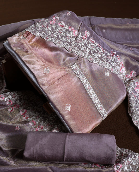 Mauve colour churidhar material with a soft sheen, adorned with pink and white floral lace embroidery & Comes with a plain matching bottom and dupatta.