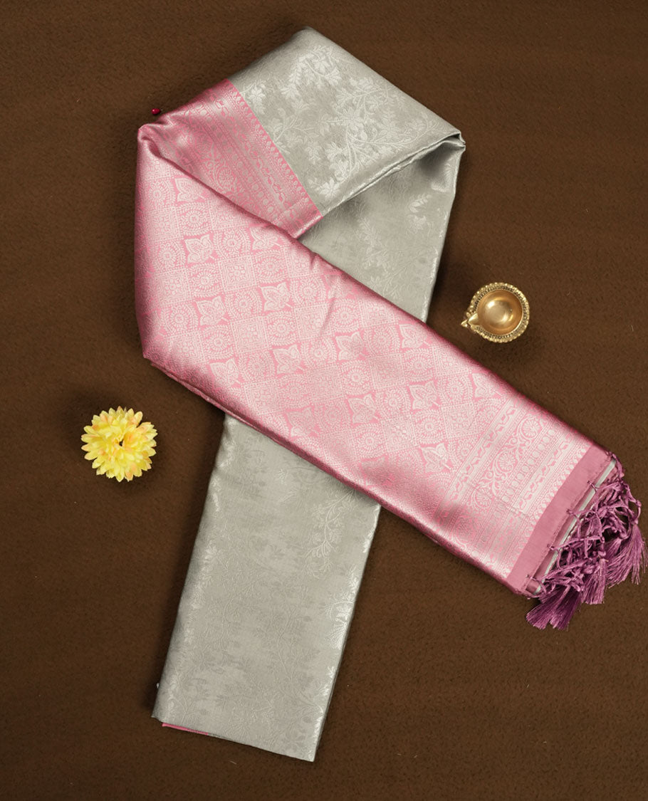 Champagne Beige colour Semi Silk Saree with Allover Subtle Floral Self-Weave on the Body, Contrasting Baby Pink Zari Woven Pallu and Border Featuring Intricate Geometric Motifs and Tassels, Paired with Coordinated Blouse Piece