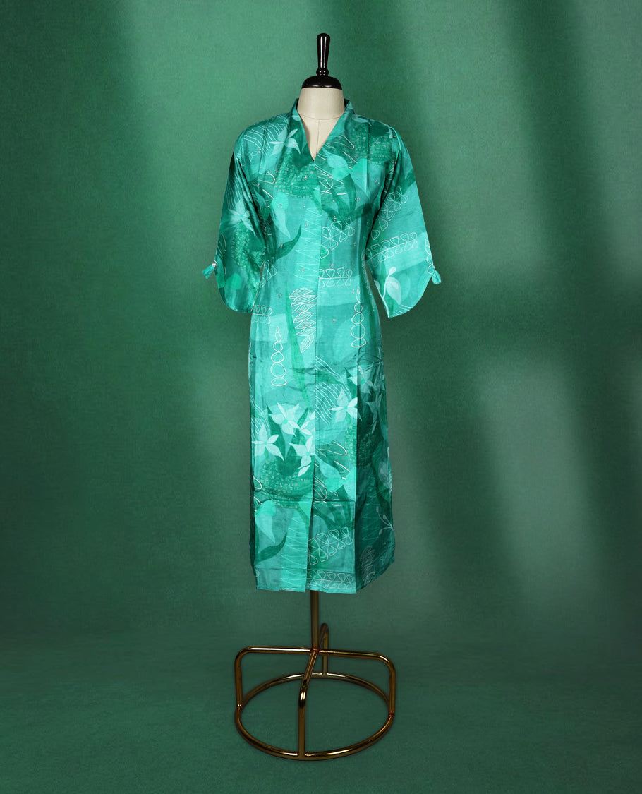 Teal green straight cut kurti with tonal abstract prints and delicate stone work on the body, featuring a V neck with notched collar and elbow length sleeves with button tabs.