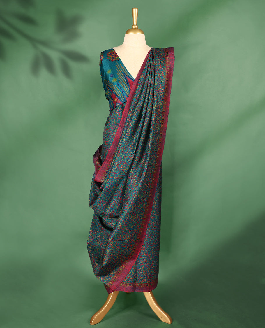 Dark teal colour Manipuri saree with multicolor micro floral patterns, magenta border with yellow detailing, and comes with a matching blouse.
