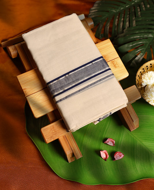 Off white colour pure handloom cotton double dhoti featuring a dark blue and silver kara with subtle textured detailing, designed for traditional grace, cultural elegance, and everyday comfort.