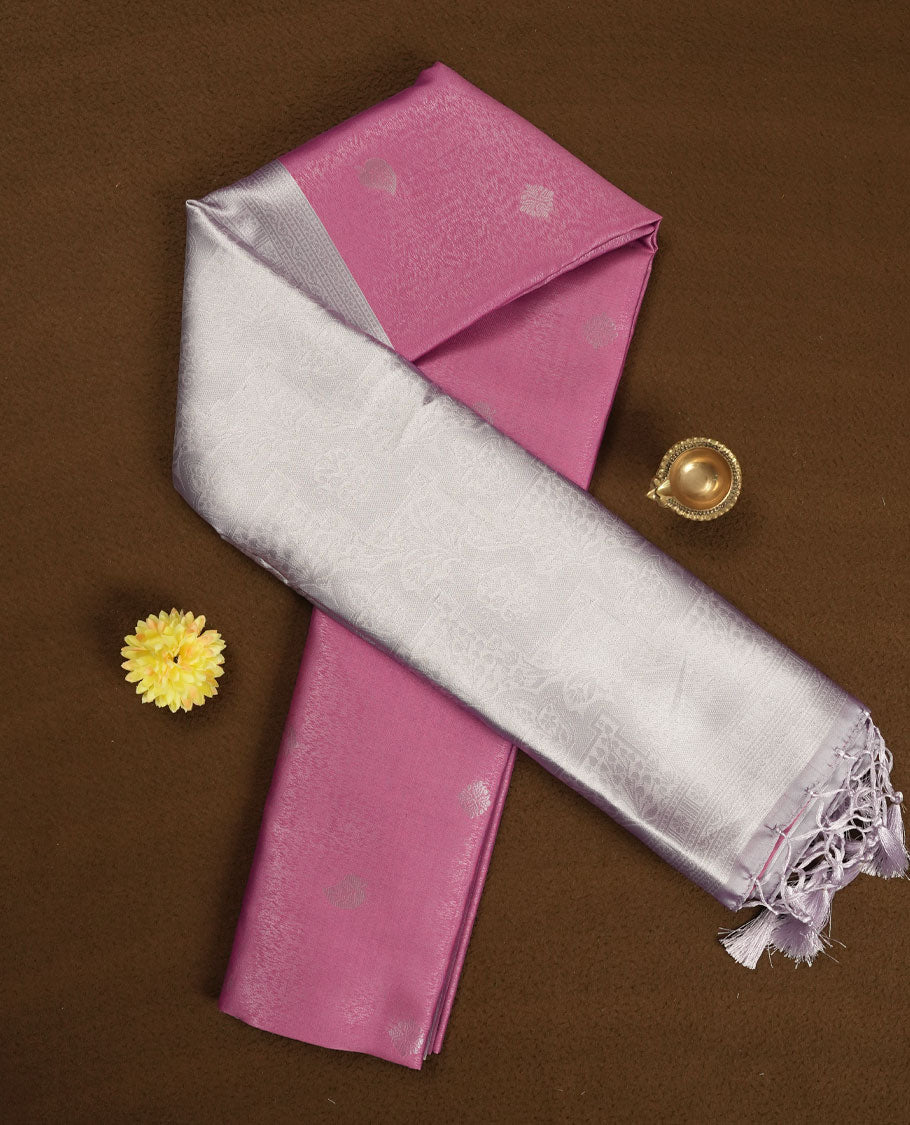 Rose Pink colour Semi Silk Saree with Subtle Zari Butta Motifs on the Body, Contrasting Silver Zari Woven Pallu and Border Featuring Intricate Patterns and Tassels, Paired with Coordinated Blouse Piece