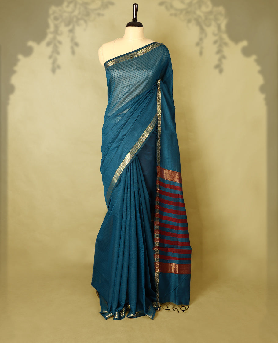 Deep Teal colour chanderi cotton saree with fine striped body, mangalgiri border, grand pallu featuring Maroon and gold zari stripes, with matching blouse.