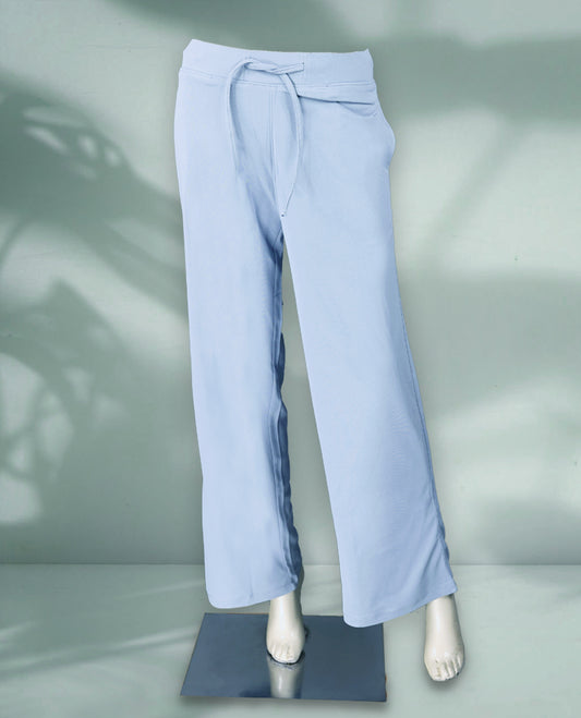Light blue colour women's pants with a relaxed fit, breathable textured fabric, and an elastic waistband with drawstring