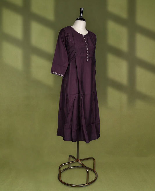Rich Brown coloured kurti crafted in silk blend fabric, adorned with subtle beadwork on the yoke and embroidered placket, featuring a round neckline and 3/4th sleeves with embroidered cuffs.