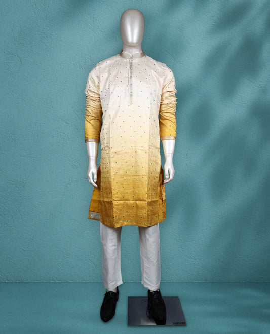 Ivory to yellow ombre semi silk kurta set featuring self colour thread and sequin work on the body, full sleeves, and paired with a matching bottom.