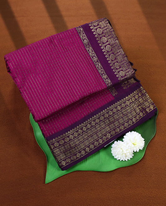 Magenta colour Kalyani cotton saree featuring silver zari checkered weave throughout the body, paired with a rich Purple colour traditional zari woven border and pallu, with matching blouse.