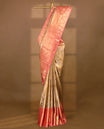 Gold colour tissue brocade saree with gold and silver zari floral pattern on body, gold zari traditional Piramide & thilakam work Blush Pink border, rich matching pallu with Antique zari motifs, paired with matching blouse.