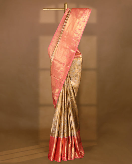 Gold colour tissue brocade saree with gold and silver zari floral pattern on body, gold zari traditional Piramide & thilakam work Blush Pink border, rich matching pallu with Antique zari motifs, paired with matching blouse.