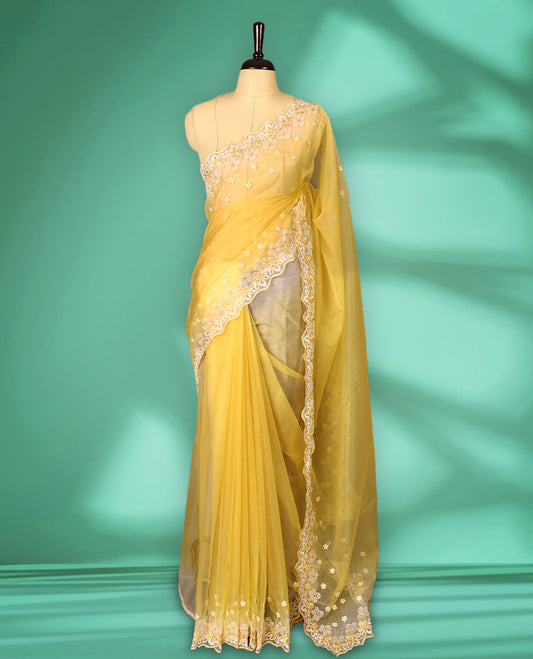 Yellow and White colour double shade organza saree with delicate floral embroidery on body, intricately embroidered scallop border, floral embroidered design on pallu, with matching blouse