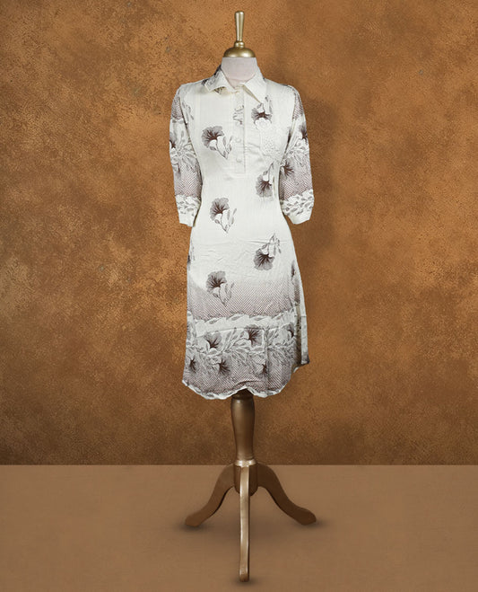 Ivory floral printed shirt dress with collared neckline, half button placket, lace-appliqué detail on chest, three-quarter sleeves, and scalloped hemline.