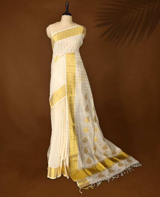 Elegant Pure handloom Kerala saree adorned with golden vertical stripes and traditional mango motifs, paired with a rich golden zari border & Comes with a matching blouse for a timeless ethnic look.