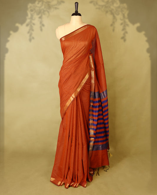 Deep Orange colour chanderi cotton saree with fine striped body, mangalgiri border, grand pallu featuring Blue and gold zari stripes, with matching blouse.