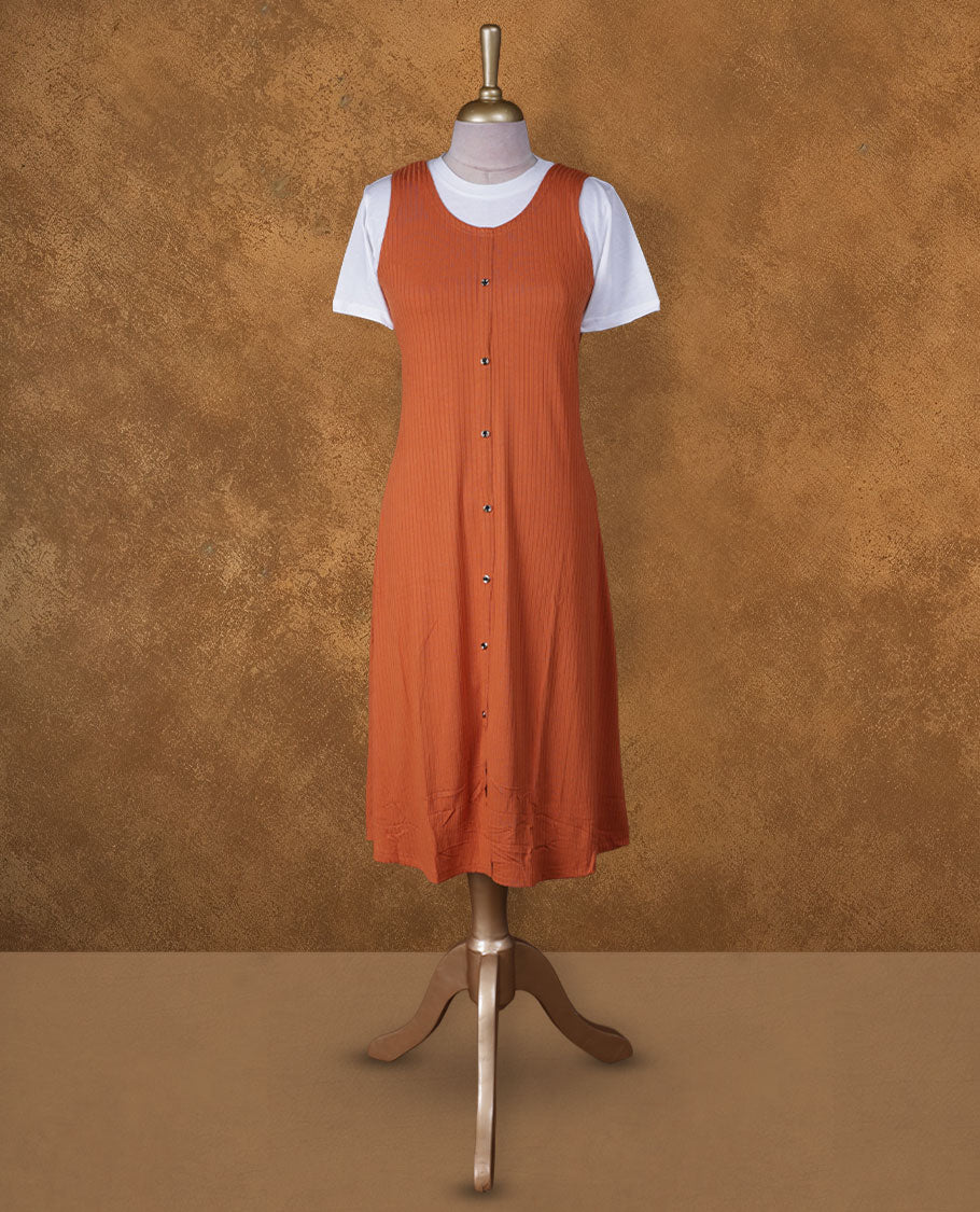Rust orange sleeveless A-line midi dress with front button detailing, layered over a white crew-neck short-sleeve inner tee