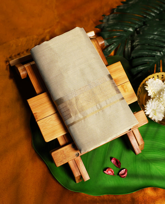 Classic pure handloom tissue double dhoti in an elegant cream shade, featuring a subtle golden zari border & A timeless blend of tradition and sophistication, perfect for weddings, festivals, and cultural occasions.