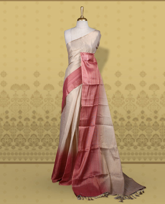 Beige and rose pink colour saree featuring a soft woven texture & The shaded pink pallu enhances its elegant drape & Finished with neat tassels and paired with a matching blouse piece.