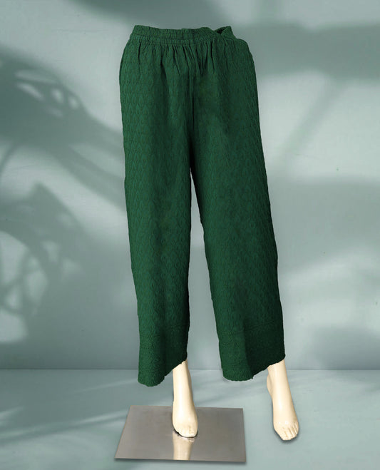 Chic green colour palazzo pants adorned with subtle self embroidery and a wide leg silhouette
