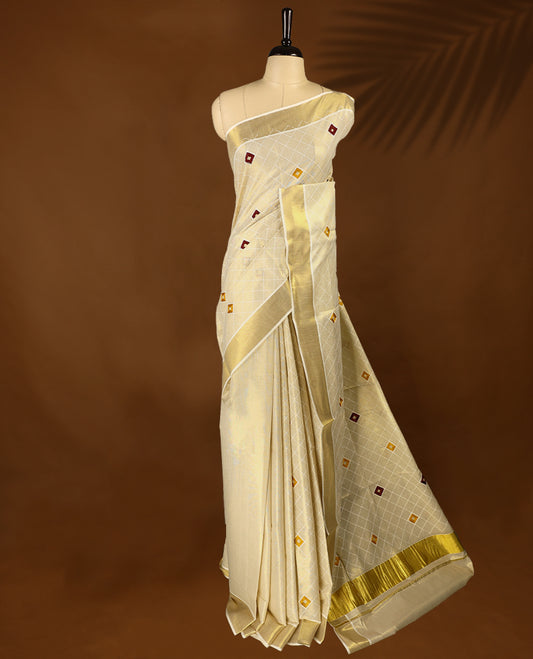 Light Gold colour Tissue Kerala saree featuring thread diamond work on body and a beautifully woven Gold Kasavu border, paired with a matching blouse perfect for festive occasions.