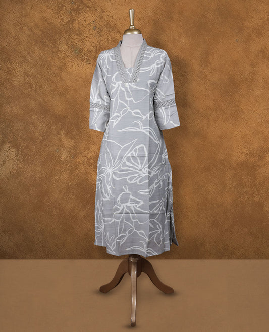 Ash colour kurti with gold & white colour printed pattern, knee length design, styled with a self colour lace Round neckline and a  sleeve .