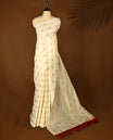 Elegant off white colour cotton Kerala saree featuring a gold Zari stripes with peacock motifs on body, with Red colour tassels offering a classic and graceful look, paired with a matching blouse.