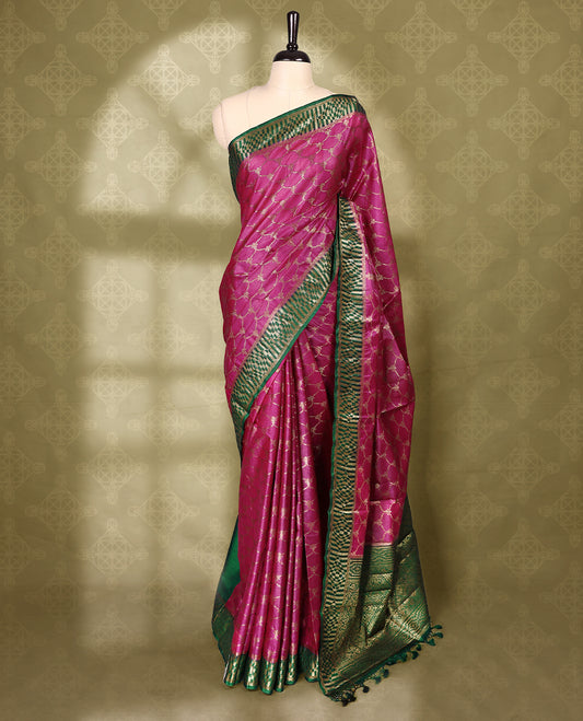 Rani pink colour pure Banaras tussar silk saree with light gold zari traditional kodi design on body, contrast deep green border featuring copper and silver antique zari traditional work, antique zari traditioal pallu, with matching blouse.