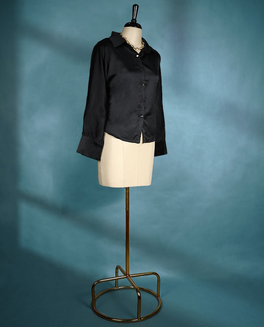 Black satin finish shirt with a collared neckline, button down front, and long sleeves for a sleek and elegant look
