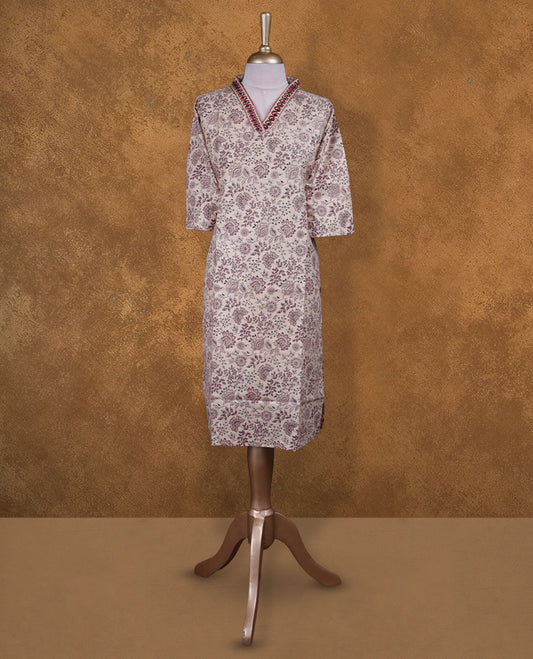 Cream colour kurti with styled with a thread pattern around neckline, print on body knee length design, and a sleeve .