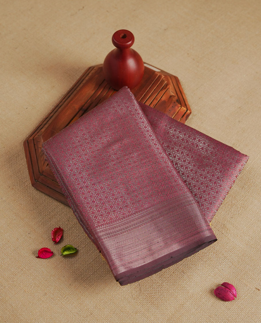 Pink colour semi silk saree featuring neem zari Brocade geometric Pattern all over the body, complemented by a Self Colour woven border with detailing, Pallu & blouse.