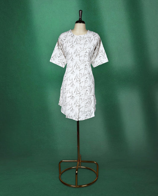 White short kurti featuring a soft cotton base with elegant all over black leaf print, styled with a round neckline and elbow length sleeves for a casual and breezy everyday look