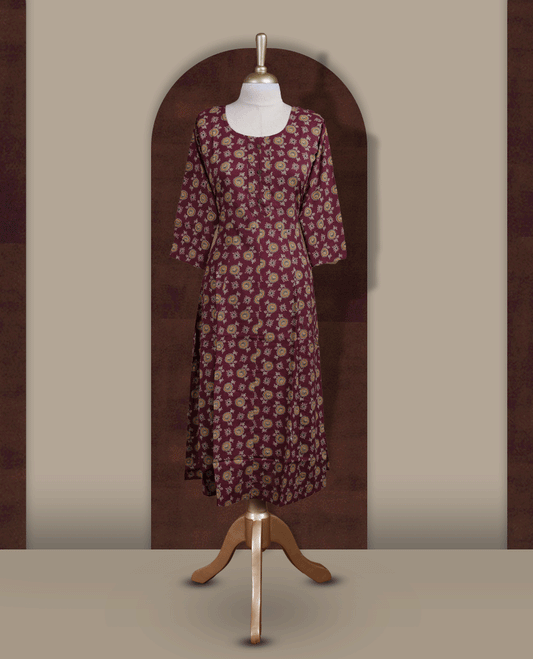 Grape colour kurthi adorned with  floral prints, featuring a classic round neckline with front buttons and comfy 3/4th sleeves.