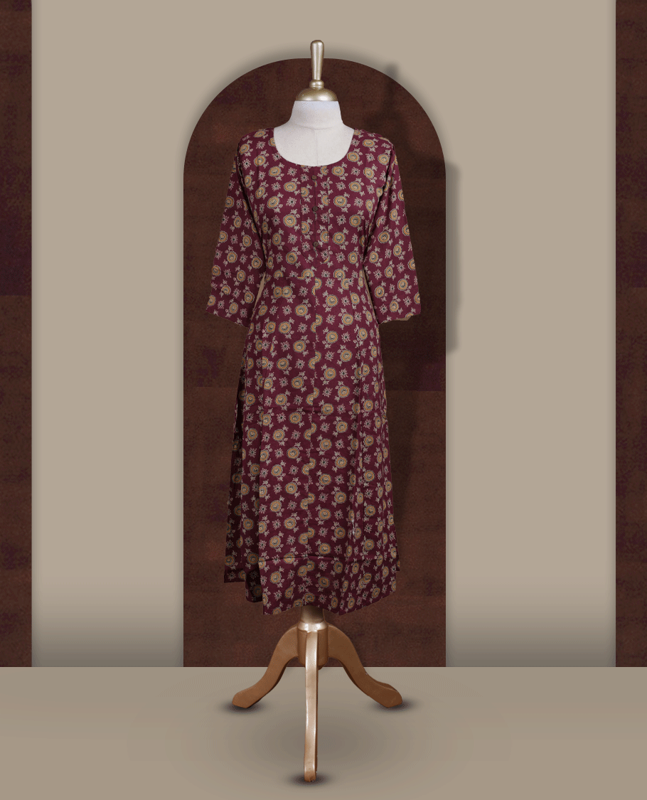 Grape colour kurthi adorned with  floral prints, featuring a classic round neckline with front buttons and comfy 3/4th sleeves.