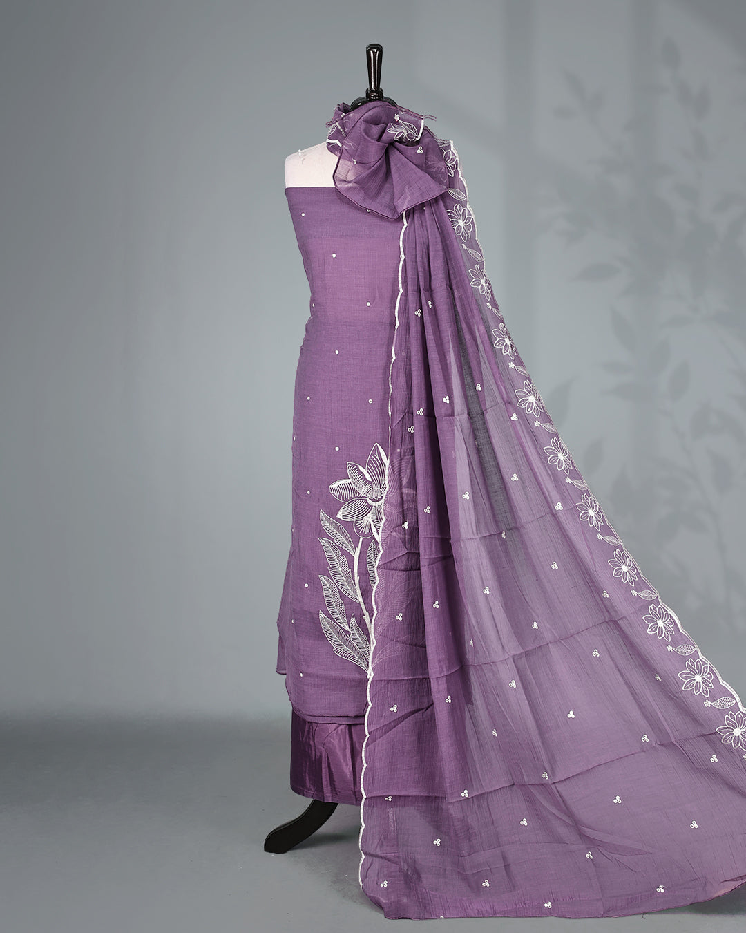 Lavender Purple Colour Mul Chanderi Salwar Material Featuring Elegant White Floral Thread Embroidery on the Kurta, paired with a matching bottom & graceful embroidered Dupatta.