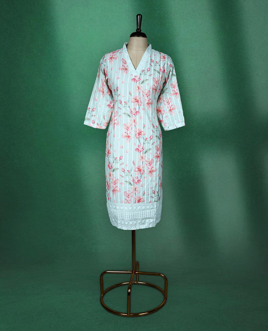 Mint green cotton kurti adorned with pink floral prints and white vertical stripes, featuring a V slit collared neckline, three quarter sleeves, and a white lace trimmed hem, fresh and feminine pick for everyday comfort.
