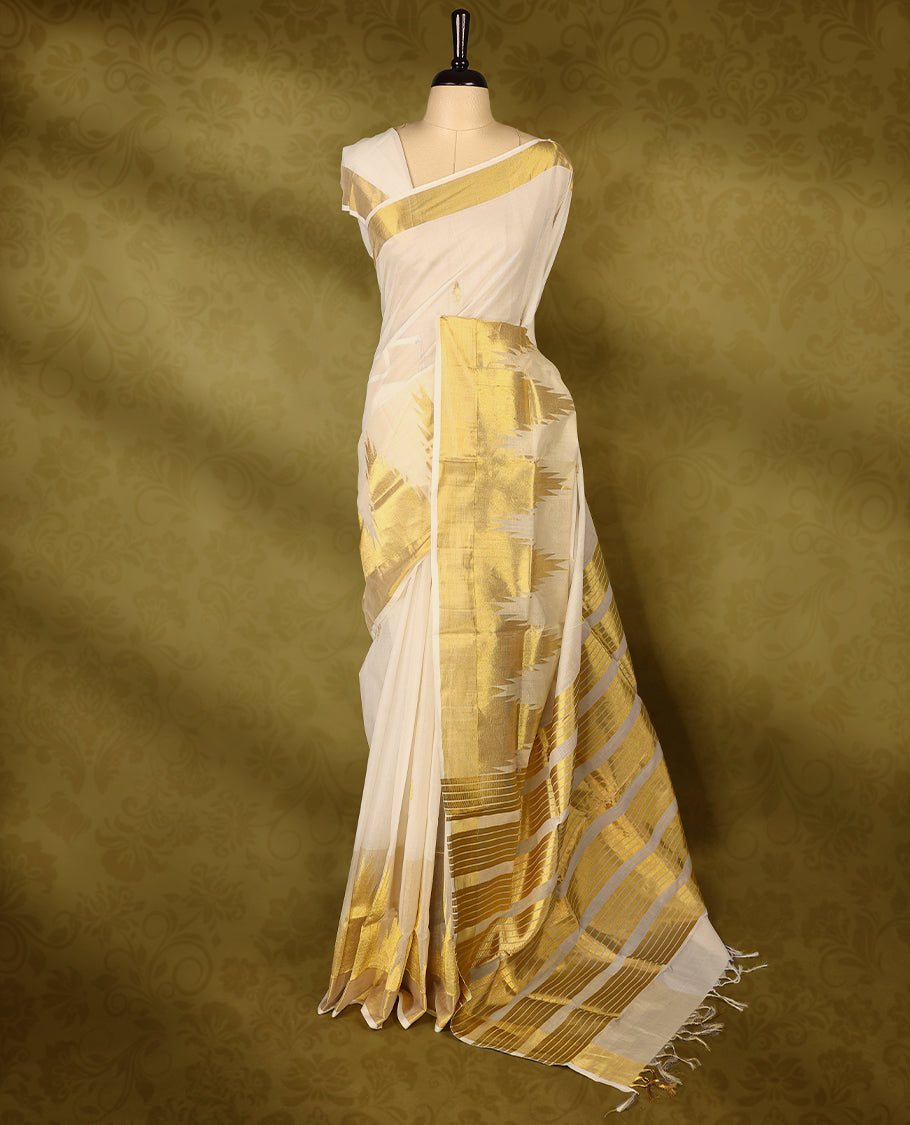 Off white colour pure narial handloom cotton saree with small gold zari motifs on  body, golden zari border, pallu highlighted with bold golden zari stripes and abstract temple design, with matching blouse