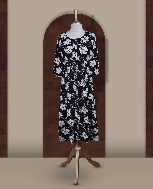 Black colour kurthi featuring with beigecolour floral prints all over & Designed with a round neckline, button placket, and 3/4 sleeves.