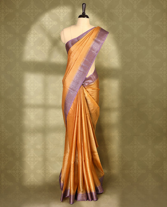 Rust Orange colour pure Banaras tussar silk saree with light gold zari small checked body, contrast purple border featuring copper and silver antique zari traditional work, antique zari brocade pallu, with matching blouse.