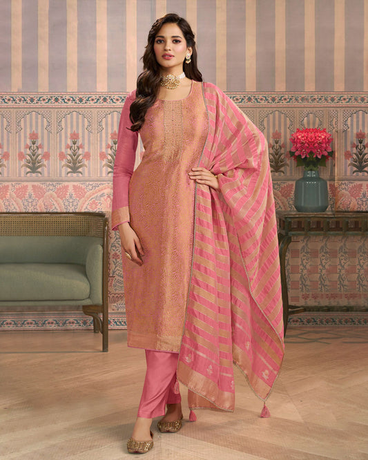 Peach colour silk suit material with Gold zari rose petal pattern and stone work, paired with premium soft santoon bottoms and a silk dupatta detailed with stripped work
