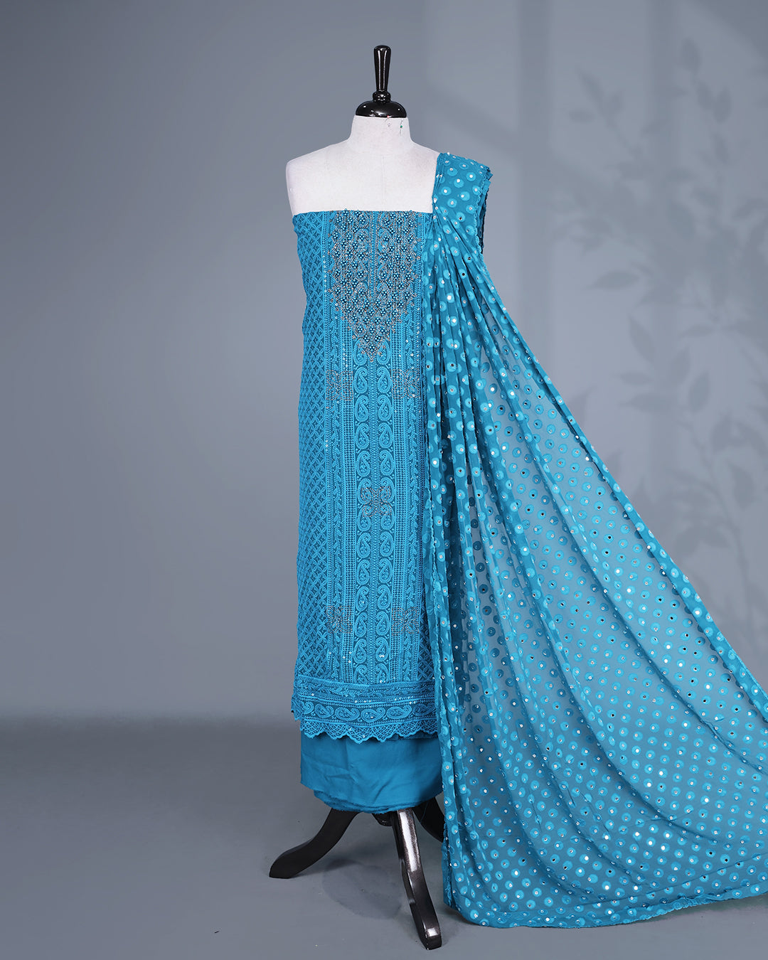 Teal Blue Colour Georgette Salwar Material featuring elegant Chikankari Work on the kurta, paired with a matching bottom & elegant sequined Dupatta.