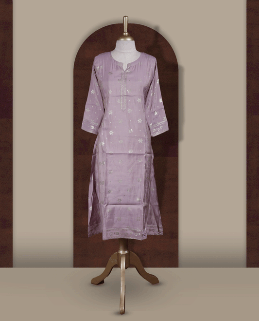 Soft Lavender colour Kurti adorned with all over Gold colour floral Block prints, featuring a straight cut kurta with round neckline and 3/4th sleeves.